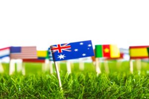 Paper cut of flags on grass for Soccer championship 2014